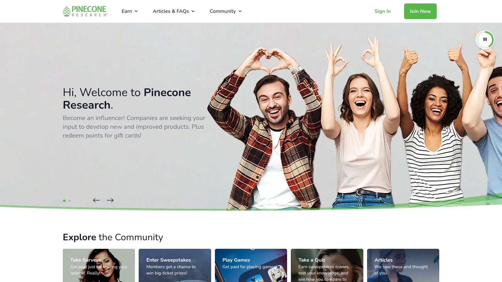 A person smiling while using a laptop, representing the positive community and earning potential with Pinecone Research, one of the highest paying survey apps.