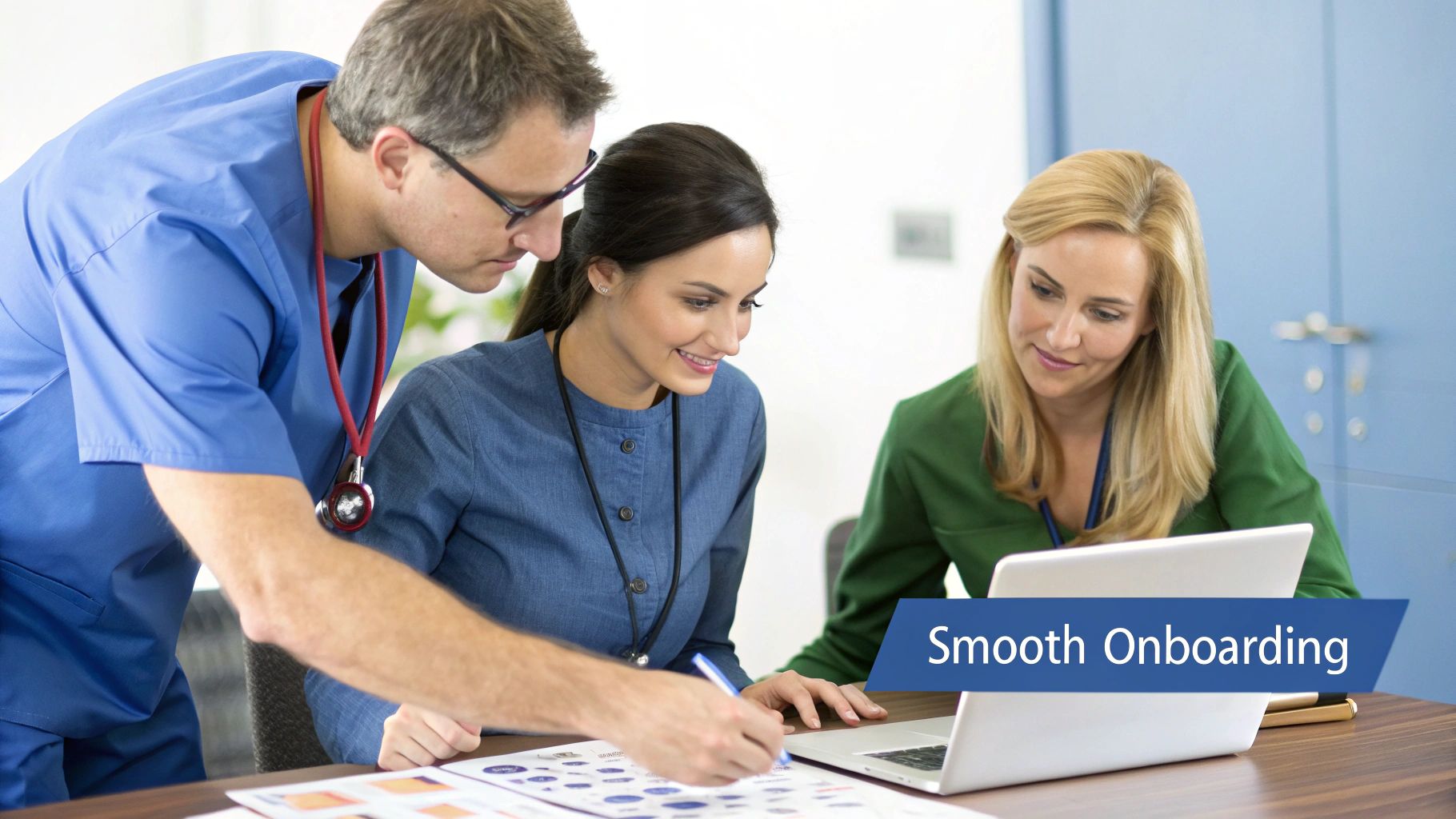Medical team members, including a doctor, collaborate on a laptop and documents during a smooth onboarding session.