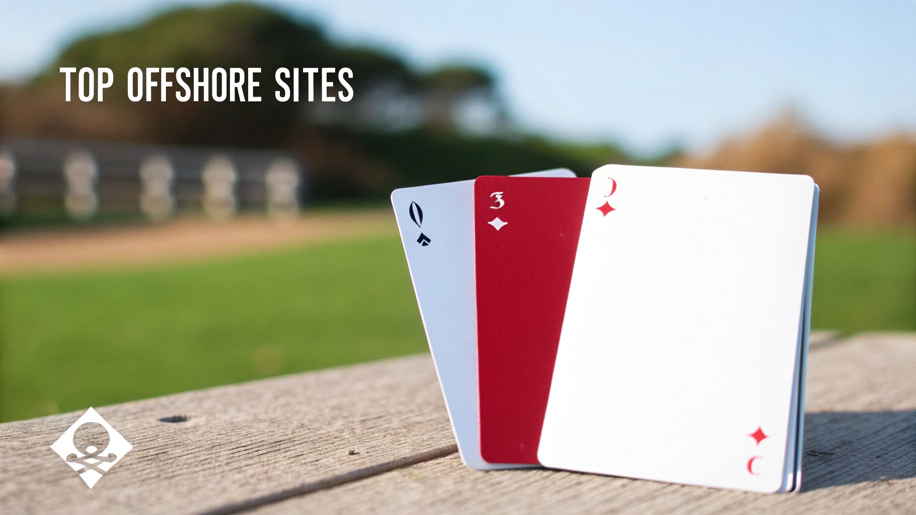 Three playing cards, Queen of Spades, 3 of Diamonds, and Ace of Diamonds, stand on a wooden table outdoors.