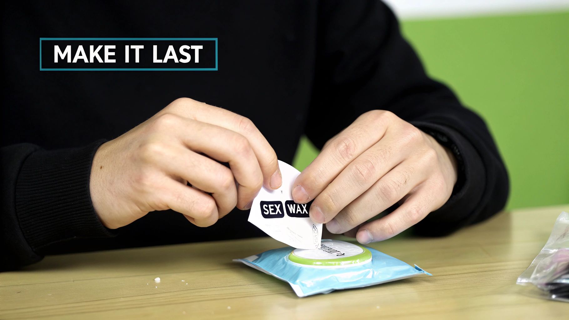 Hands opening a 'SEX WAX' air freshener package on a wooden table, with 'MAKE IT LAST' text.