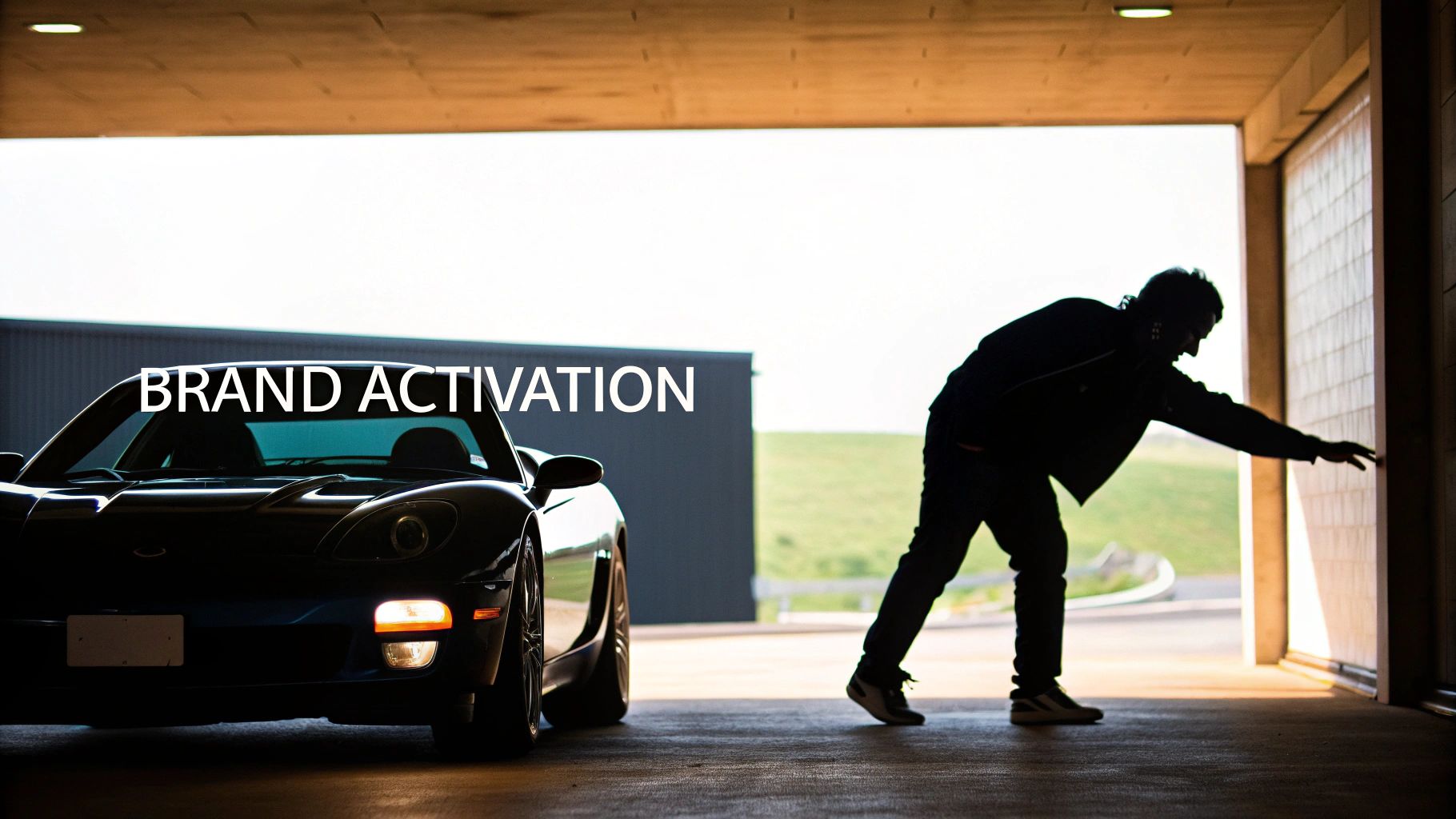 Dark sports car with a glowing headlight and a silhouetted man reaching, overlaid with 'BRAND ACTIVATION' text.