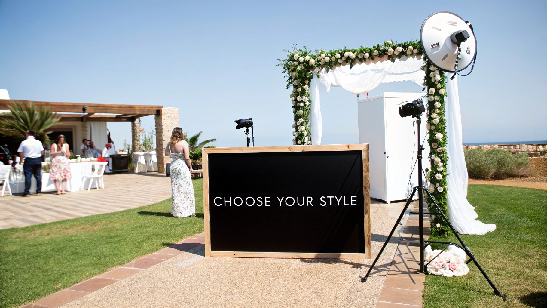 A stylish open-air photo booth setup at a wedding reception