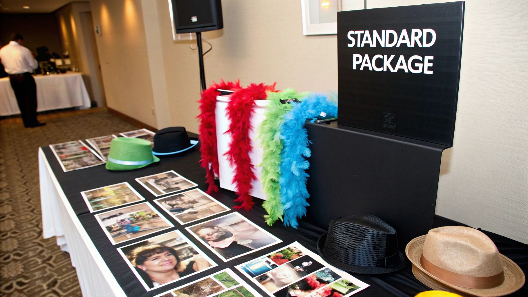A photo booth attendant helping guests with props