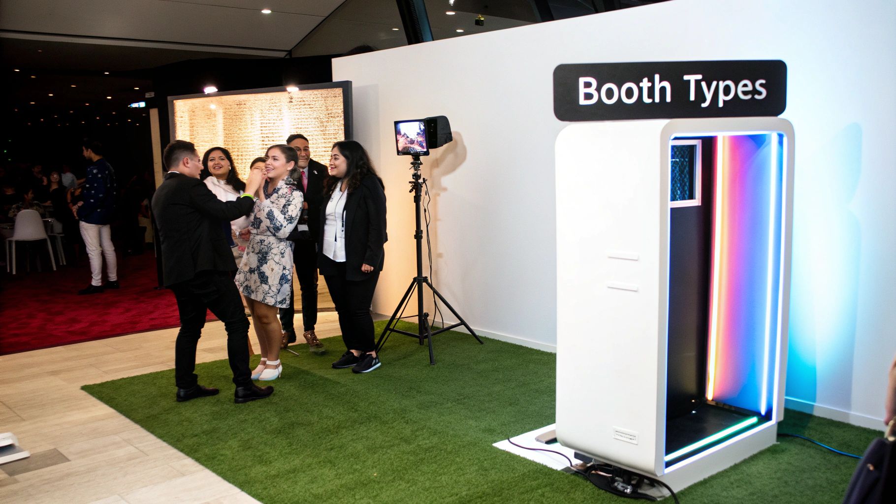Guests having fun in a modern, open-air photo booth at an event.