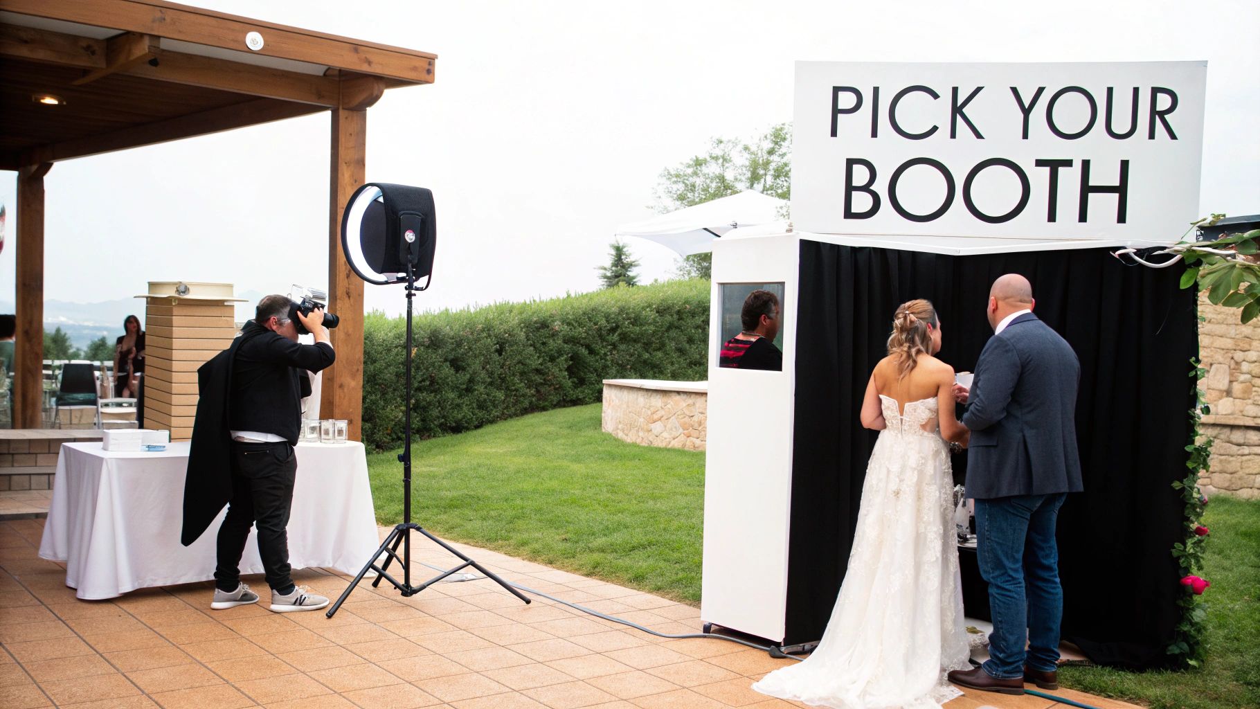 A couple and their wedding guests happily posing with fun props inside a photo booth.