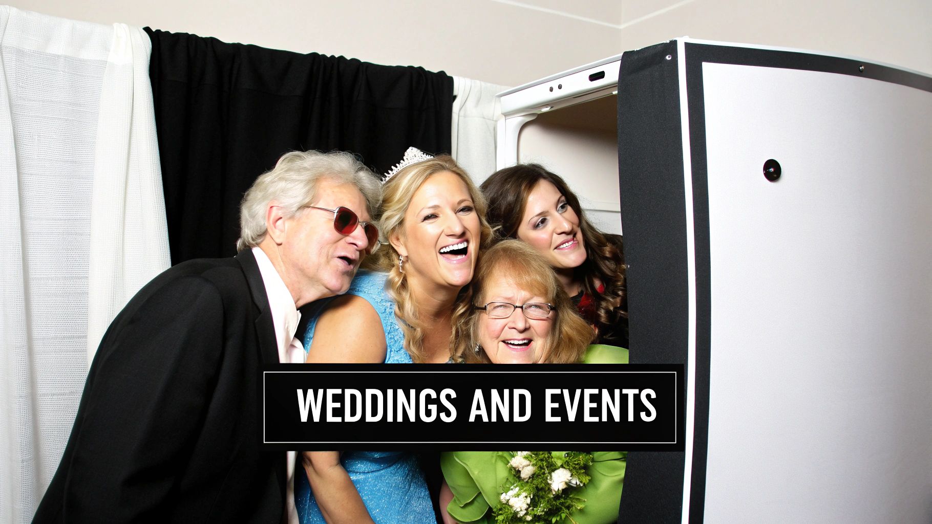 Four diverse guests laughing and posing in a classic photo booth at a wedding or special event.