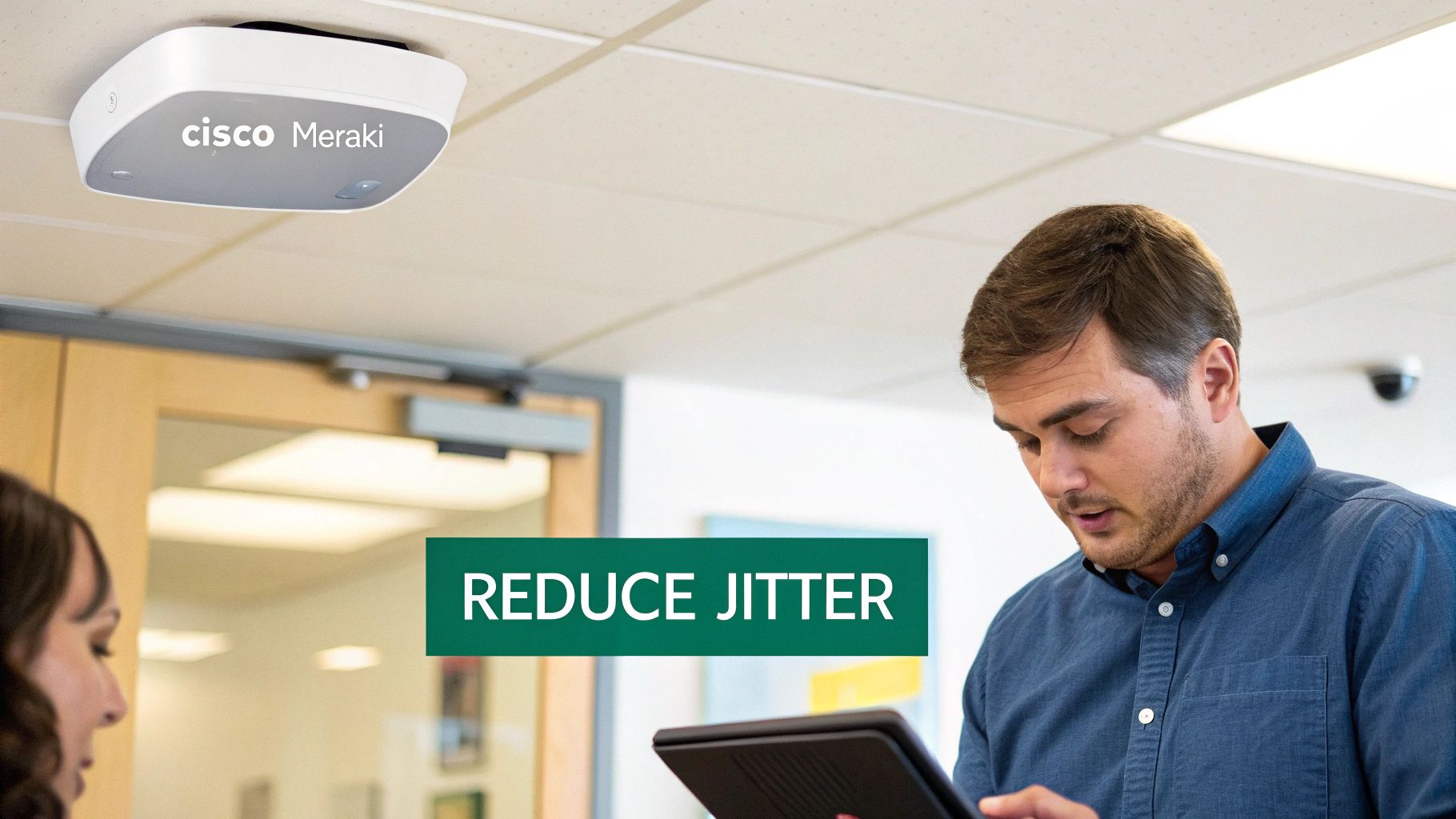 A close-up view of a Cisco Meraki Wi-Fi access point mounted on a ceiling.