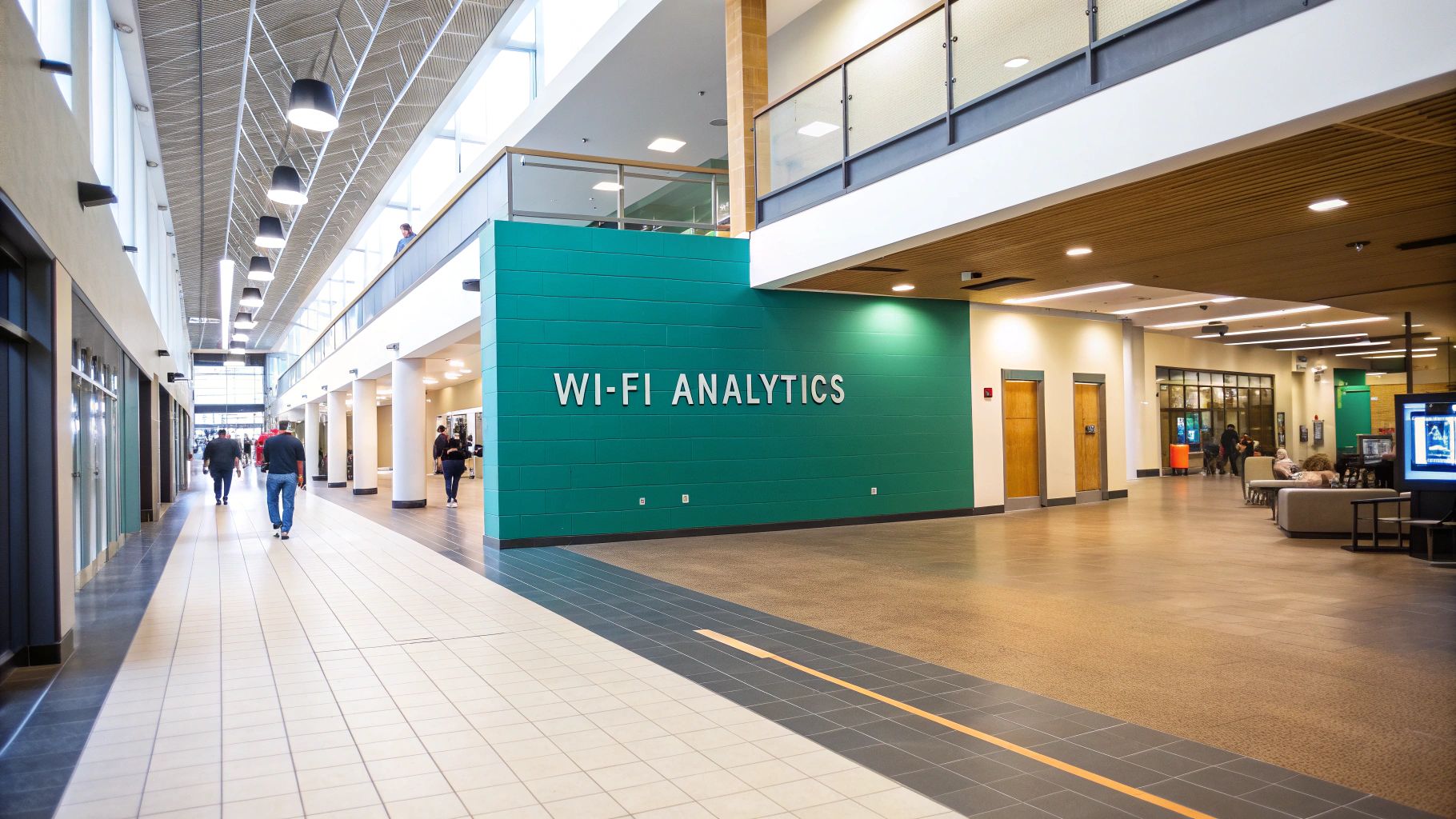 Interior of a modern building with a large teal wall displaying 'WI-FI ANALYTICS' and people.