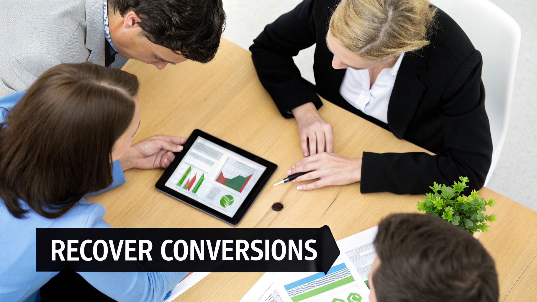 Business team reviewing conversion data and marketing strategies on a tablet and documents during a meeting.