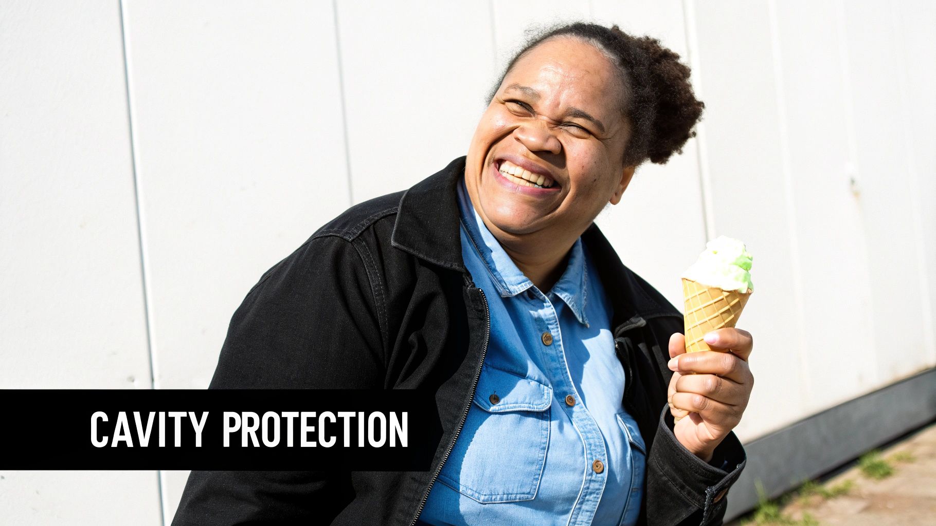 A smiling woman happily holds a green ice cream cone, with 'CAVITY PROTECTION' text.