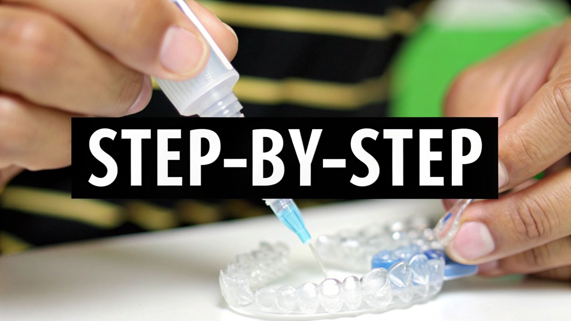 Close-up of hands applying whitening gel from a syringe onto clear dental aligners for a step-by-step process.