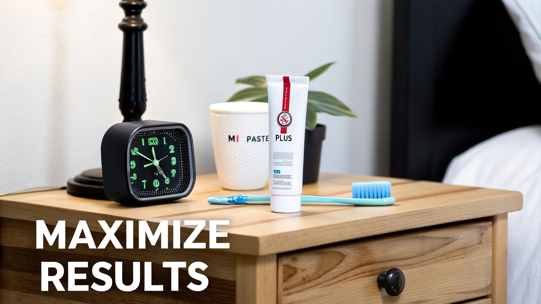 A bedside table with an alarm clock, MI PASTE PLUS toothpaste, a branded cup, and a toothbrush.