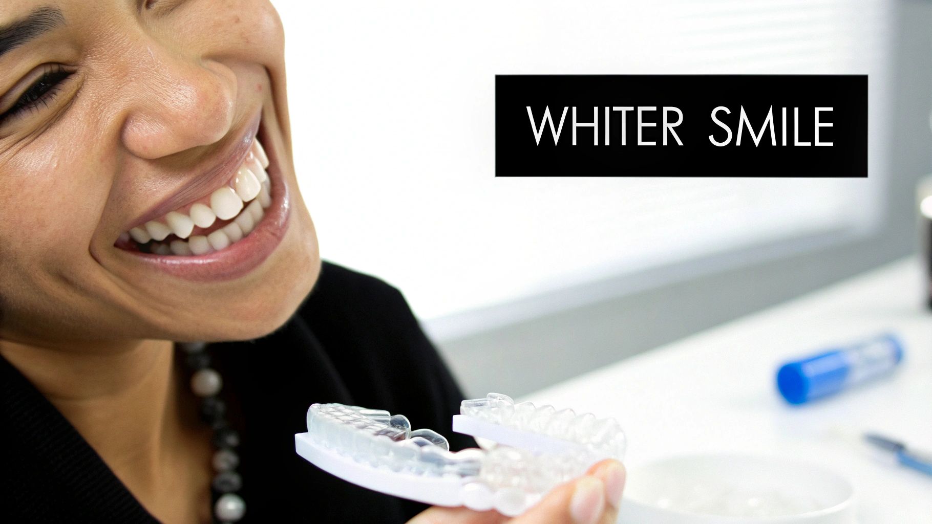 A smiling person holds a teeth whitening tray, with text "WHITER SMILE" in the background.