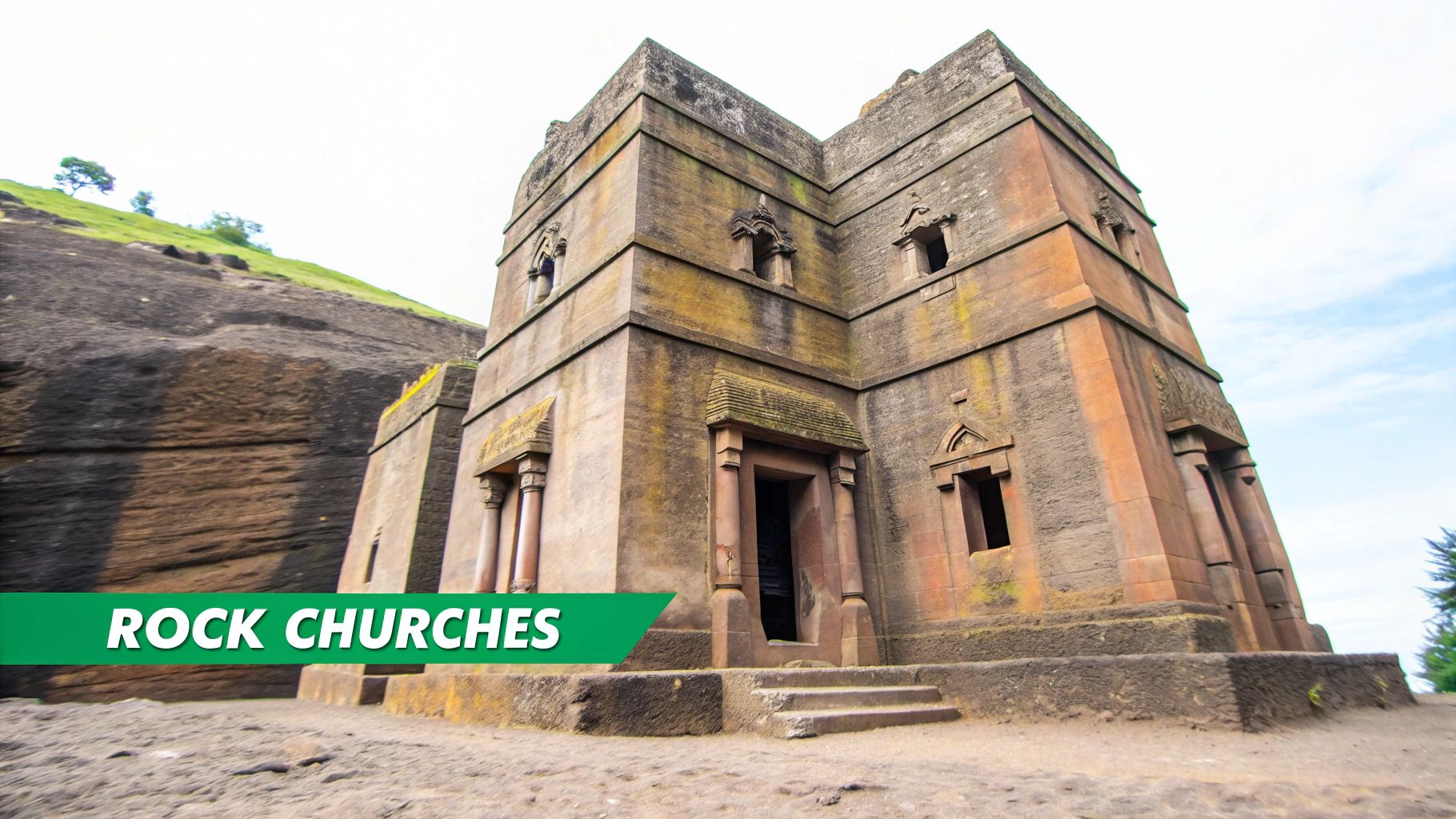 A majestic, ancient rock-hewn church, likely in Ethiopia, carved into the earth with intricate architecture.