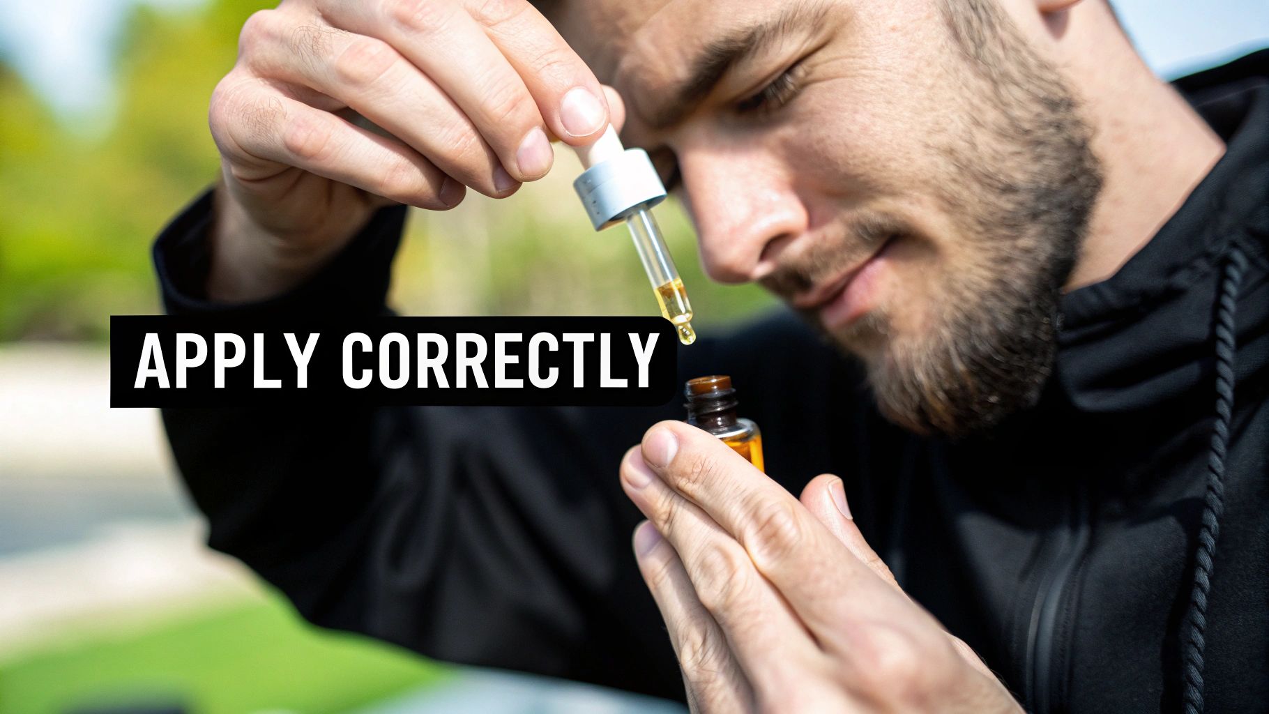 Man applying serum to his face in a modern bathroom