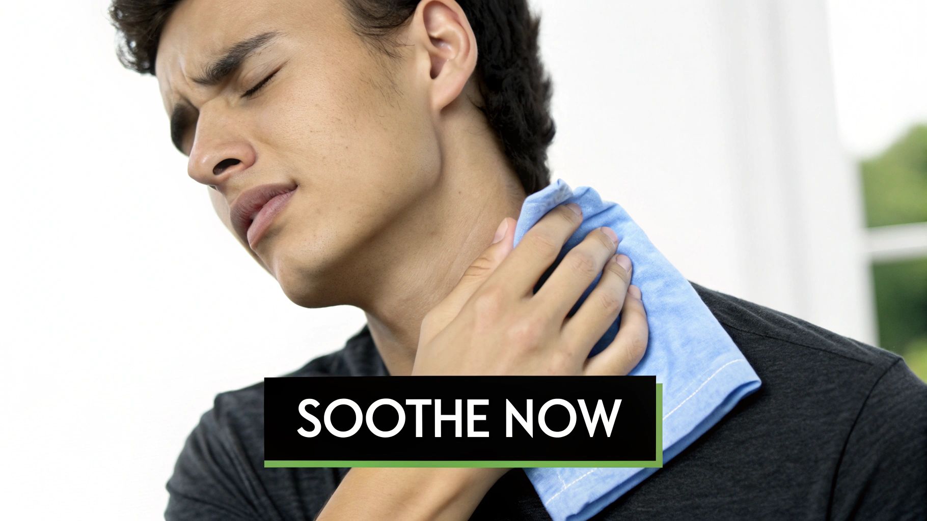 A person gently applying a warm, clean cloth to their jawline, demonstrating how to soothe razor bumps.