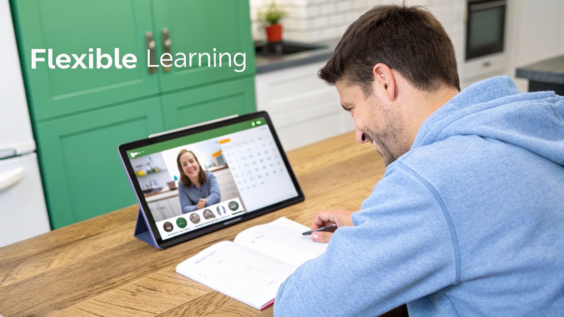 A man engages in flexible learning, writing notes while on a video call on a tablet.