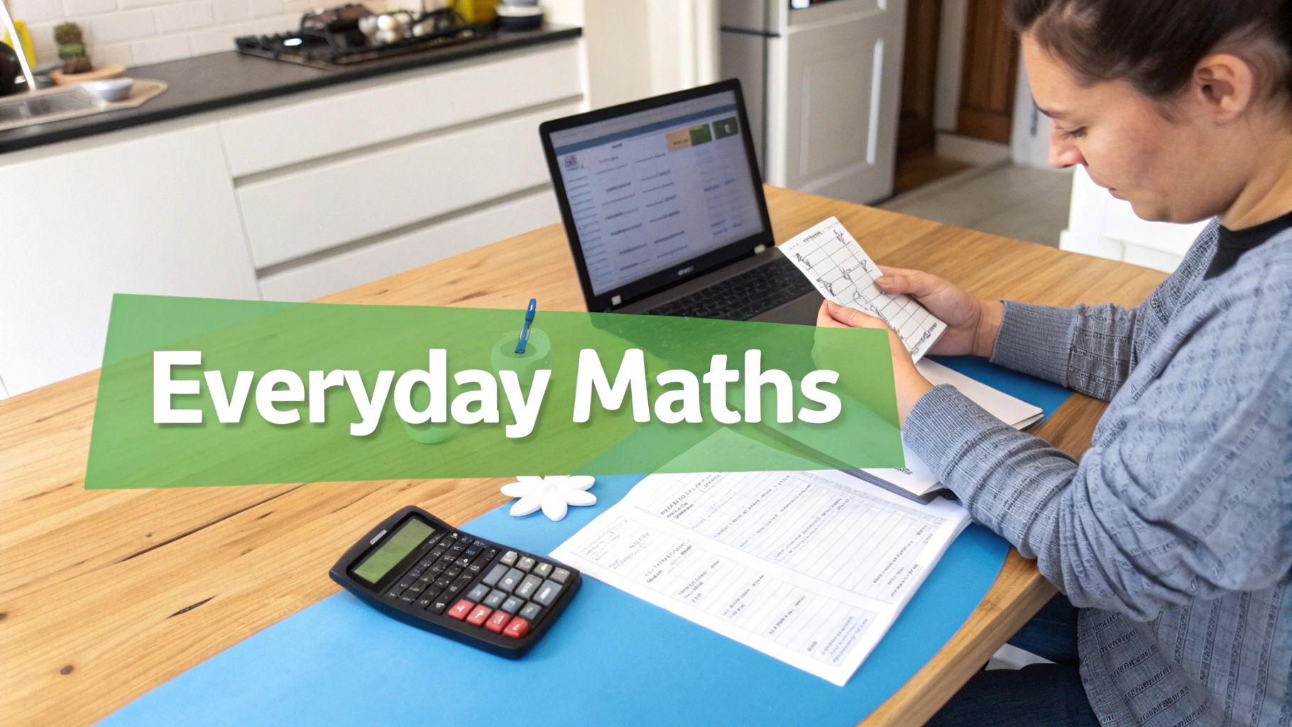 A woman studies everyday maths at a wooden table with a laptop, calculator, and papers.