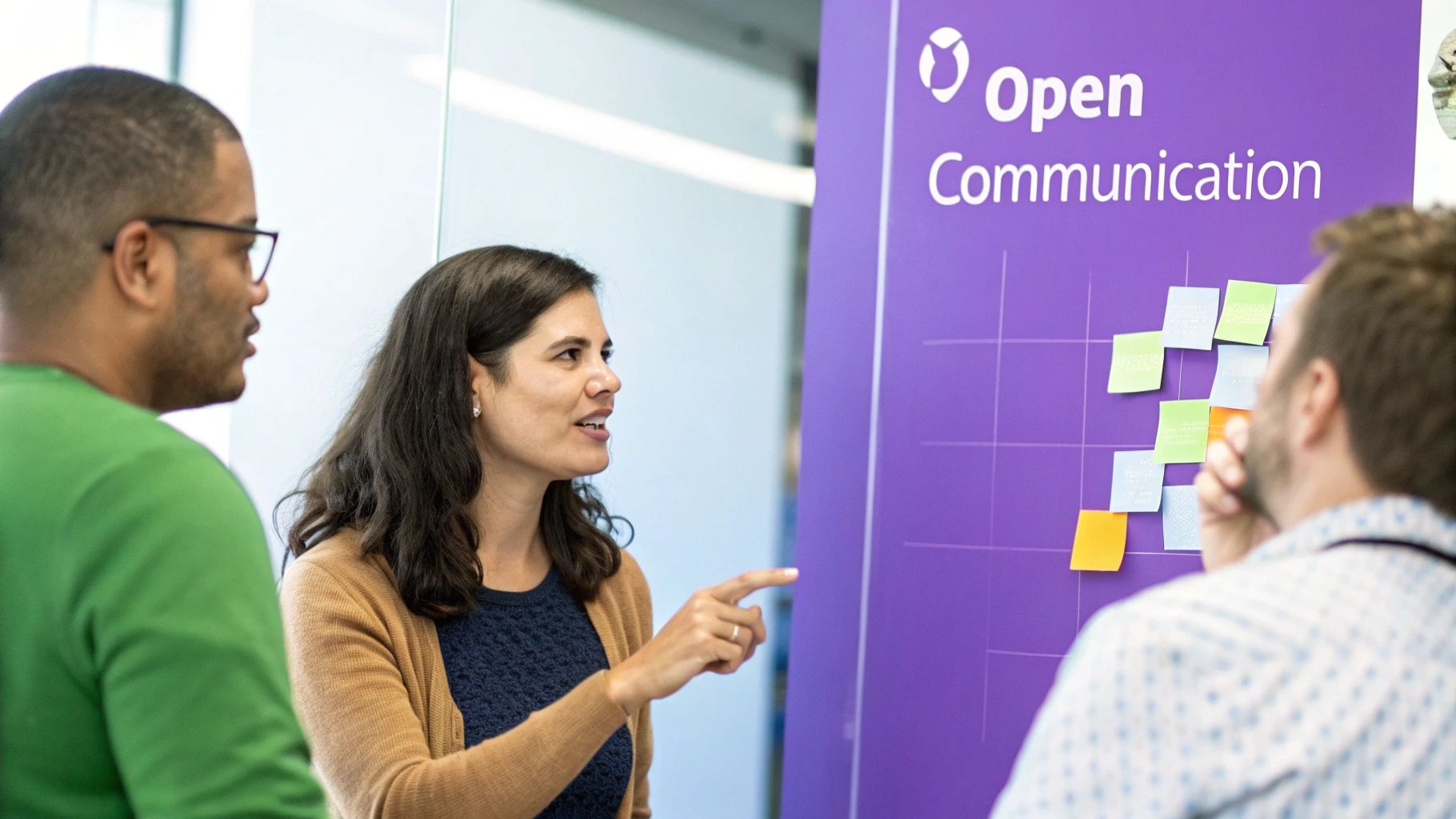 A team collaborating openly at a whiteboard, representing business transparency.