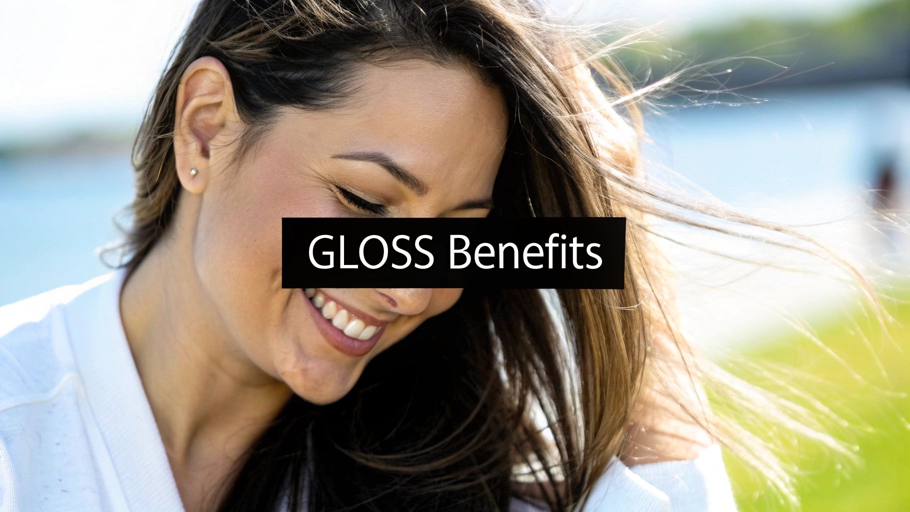 A woman showing off her healthy, vibrant, and glossy hair