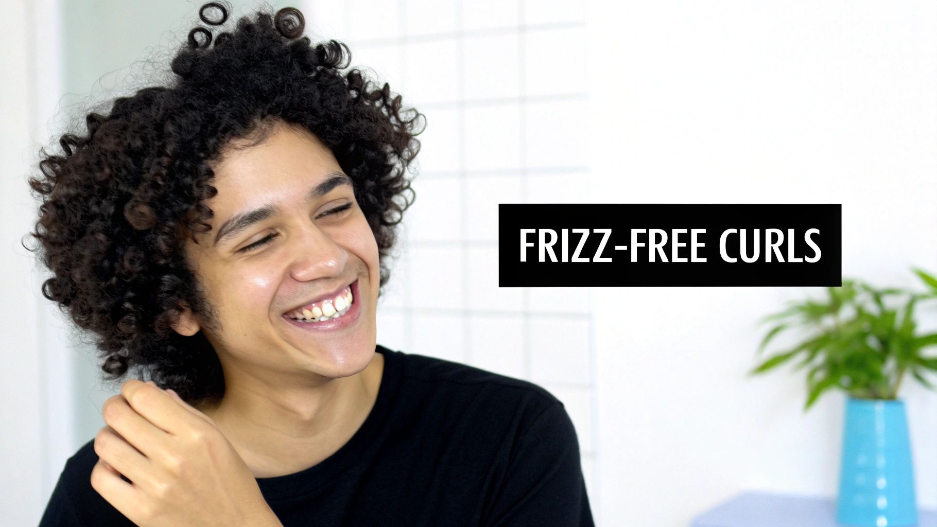 A woman with beautifully defined, shiny, frizz-free curly hair.