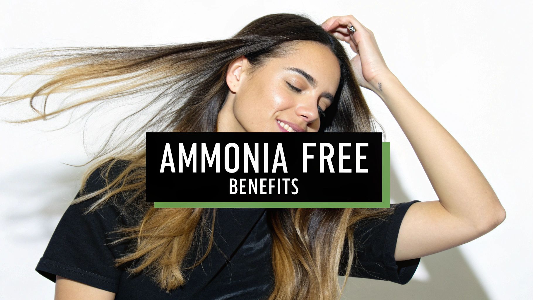 A woman with shiny, healthy hair smiling after using non ammonia hair dye.