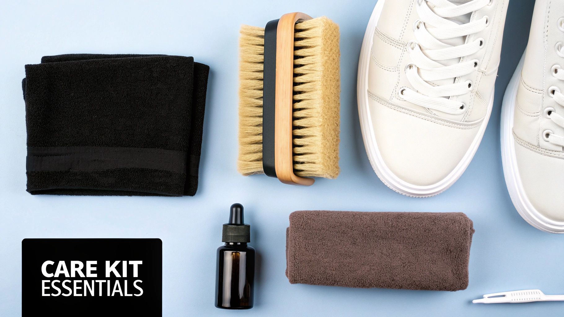 A top-down view of a sneaker care kit including white shoes, brushes, towels, and a dropper bottle on a light blue background.