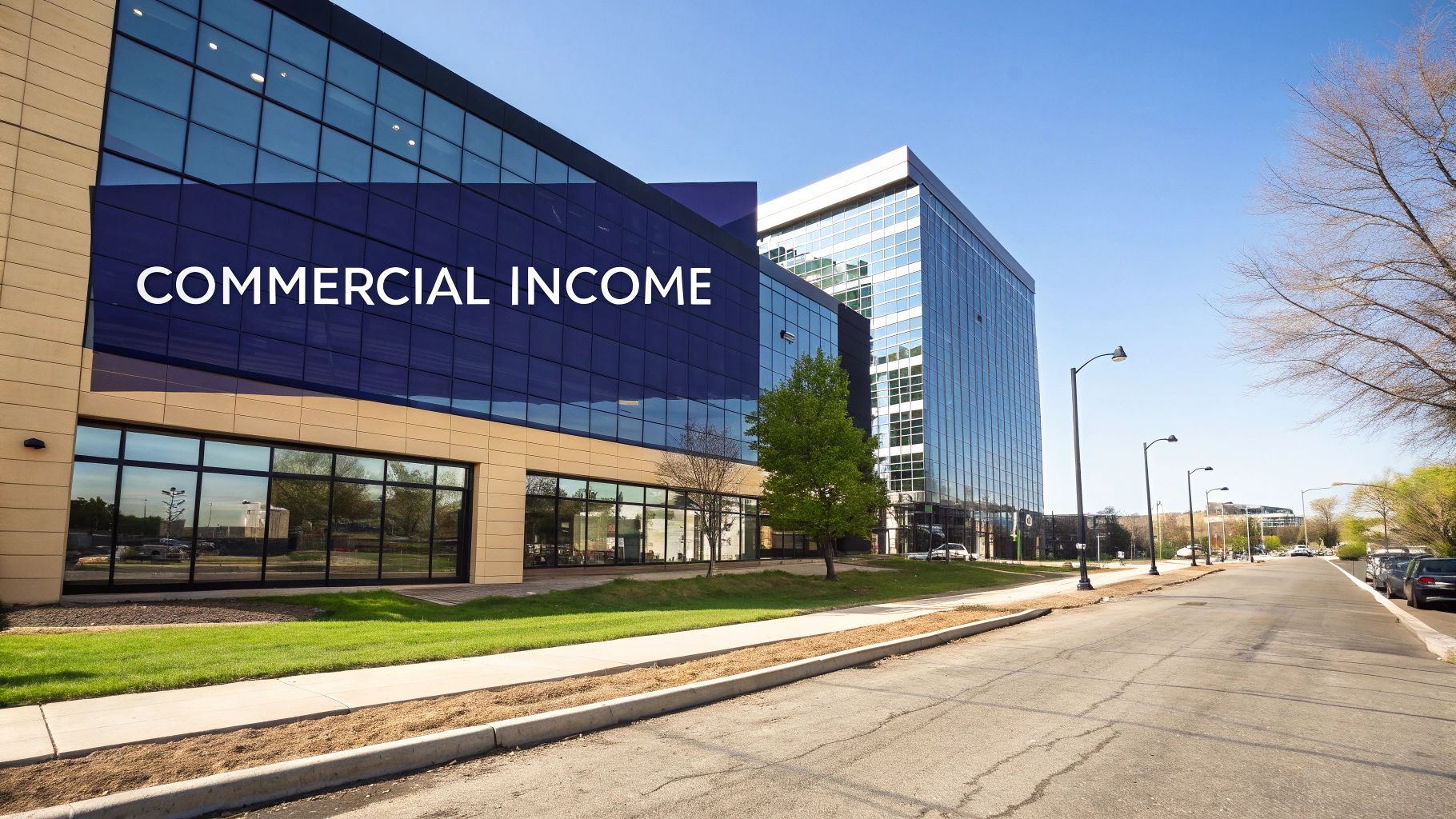 Modern commercial office buildings with reflective glass facades on a sunny day, representing commercial income.