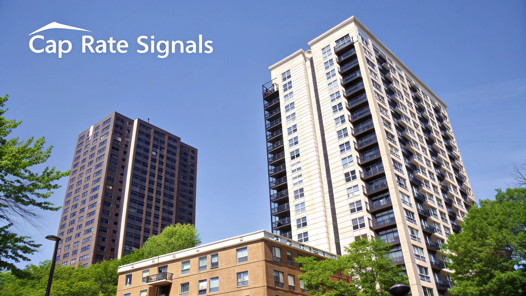 Two tall apartment buildings and a shorter brick building under a clear blue sky, with 'Cap Rate Signals' text.