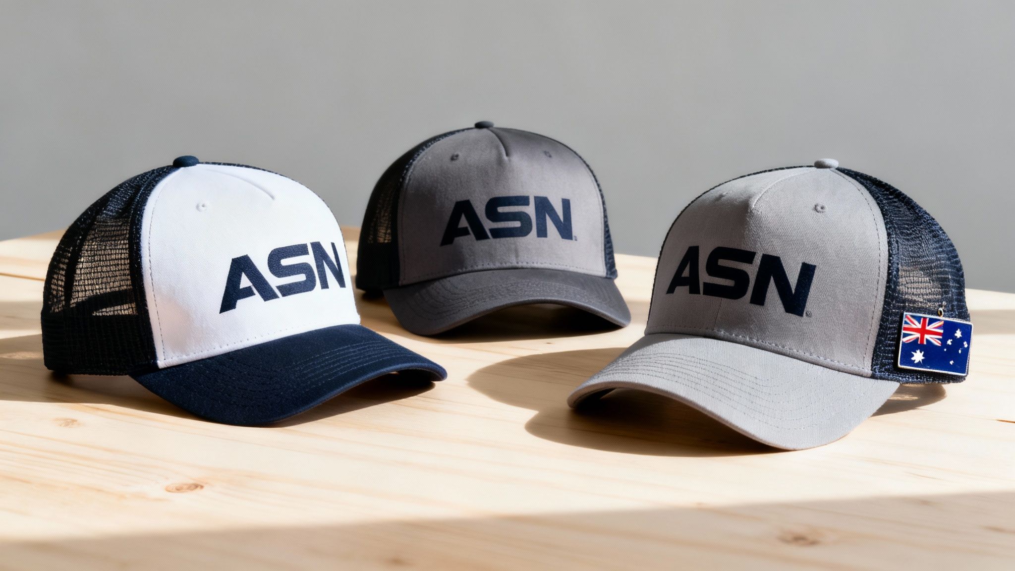 A collection of custom printed caps in various colours and styles, showcasing different branding methods.