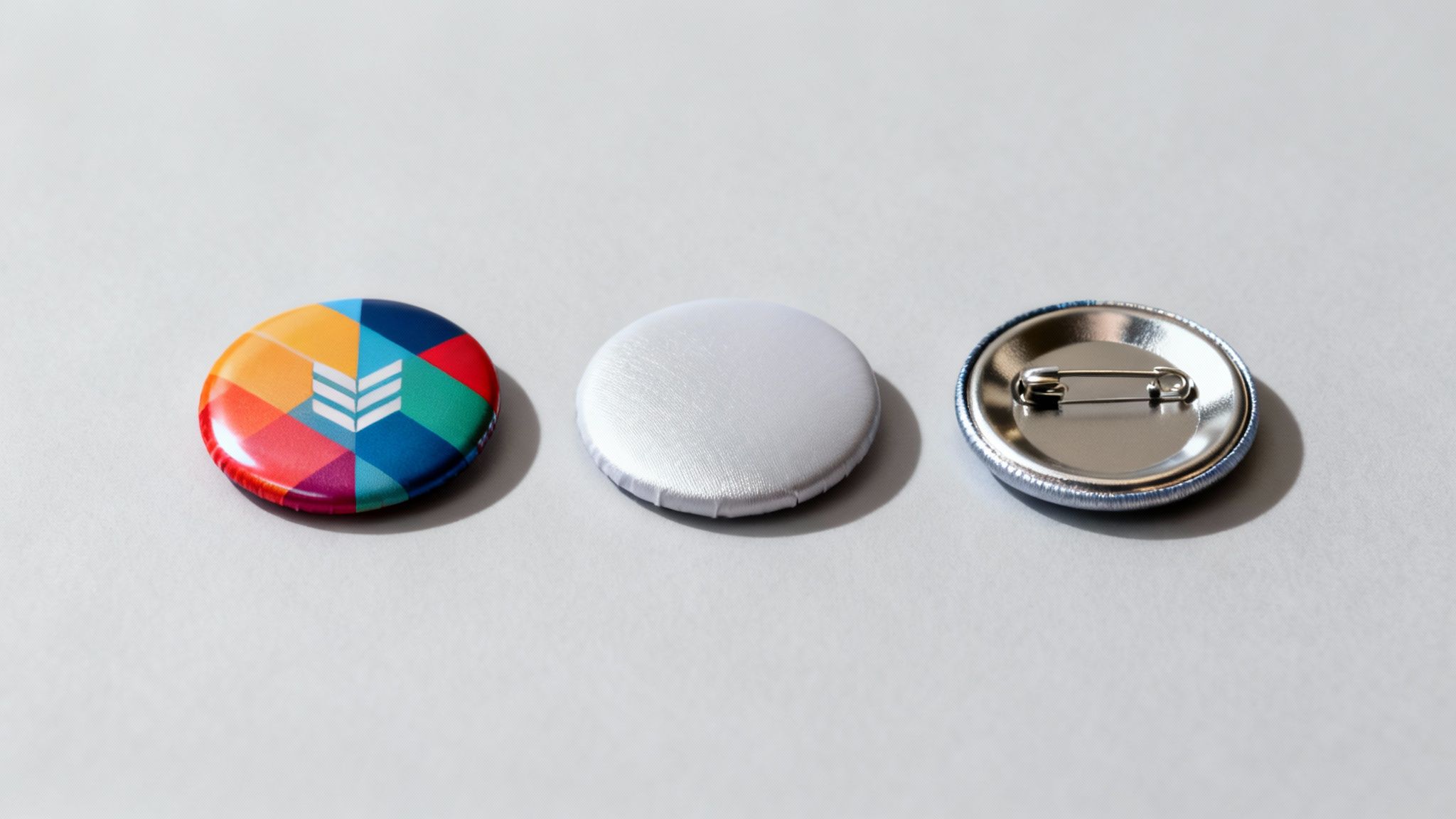 A collection of colourful button badges with different finishes