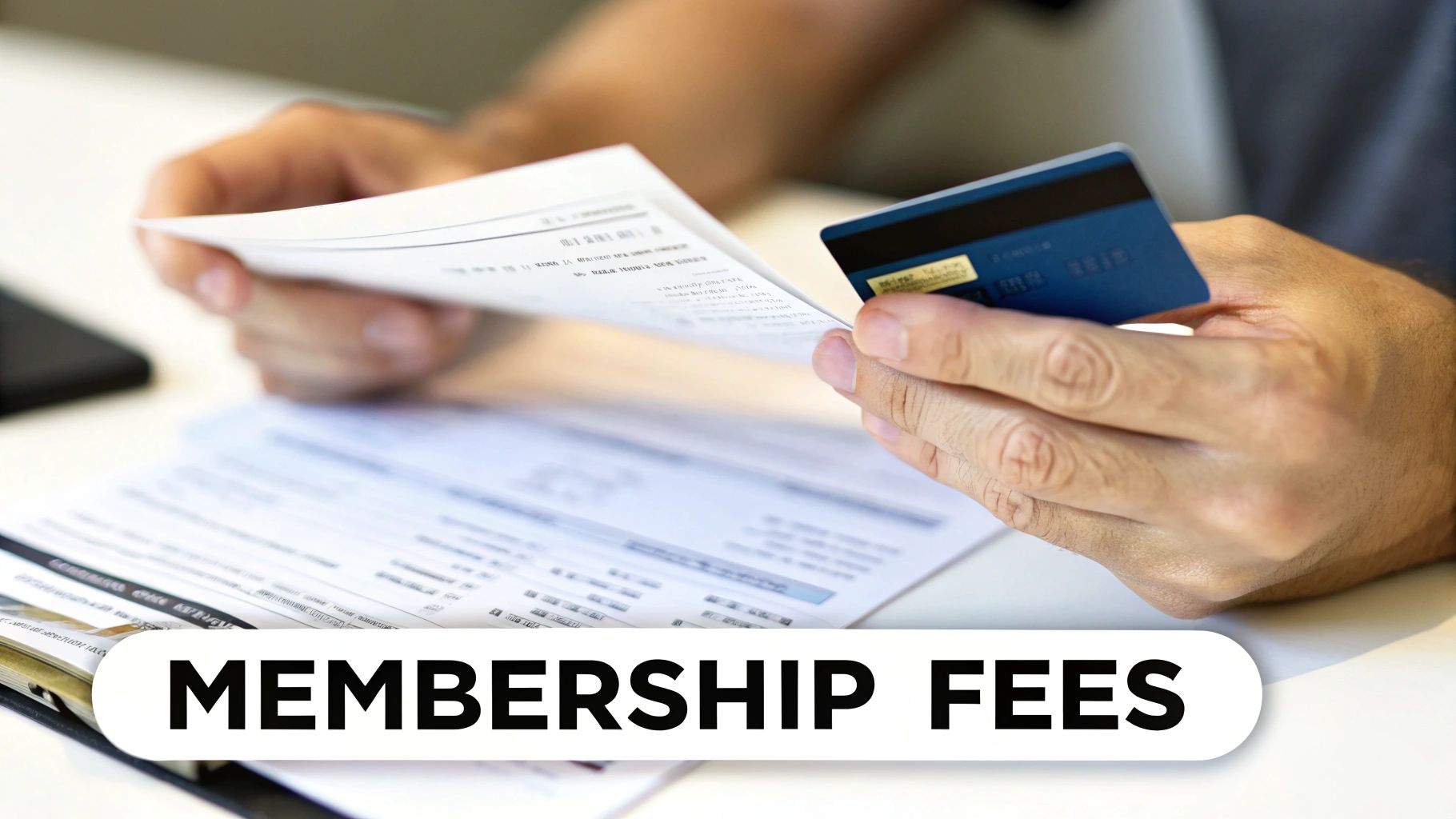 Close-up of hands holding a document and a blue credit card, with 'MEMBERSHIP FEES' text overlay.