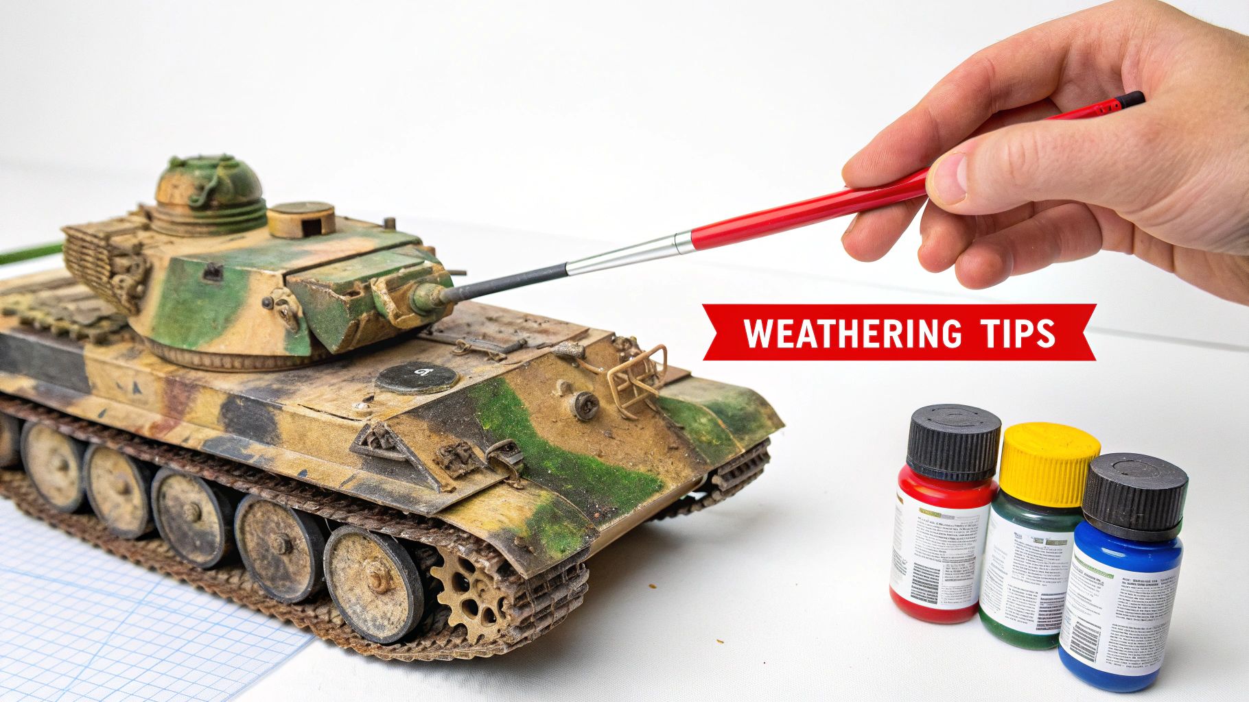 A modeler carefully painting a World War II tank model, showing various paints and brushes on the workbench.