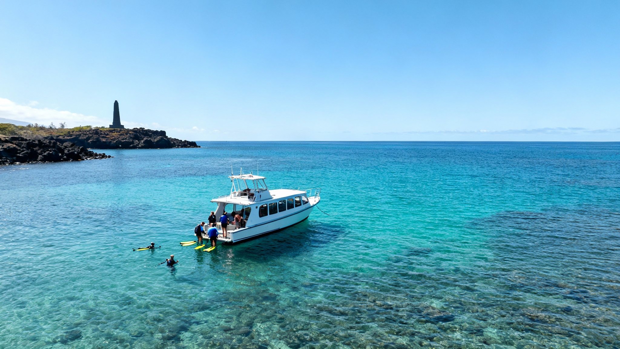 Boat and snorkelers in clear turquoise water near Captain Cook Monument on a sunny day.
