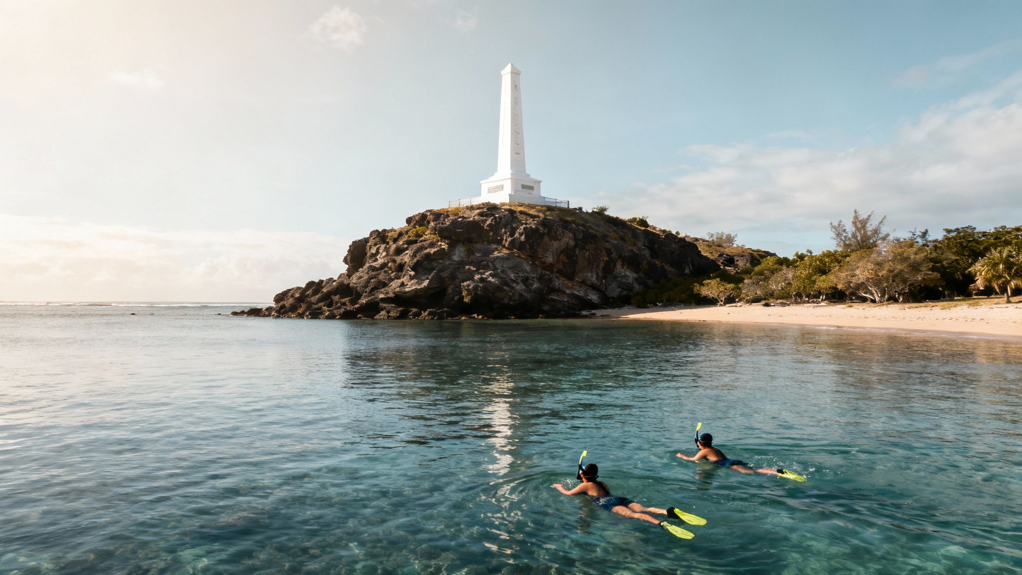 A view of the Captain Cook Monument from the water on a sunny day.