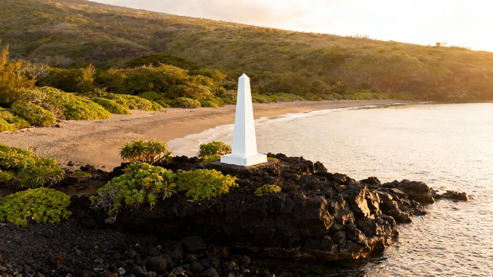 A view of the white Captain Cook Monument from the clear waters of Kealakekua Bay.
