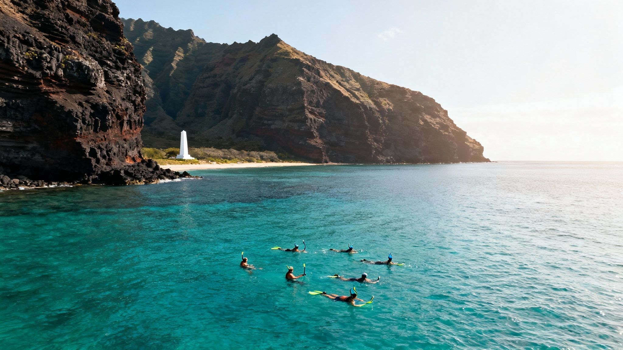 A group of snorkelers exploring the clear waters near the Captain Cook Monument.