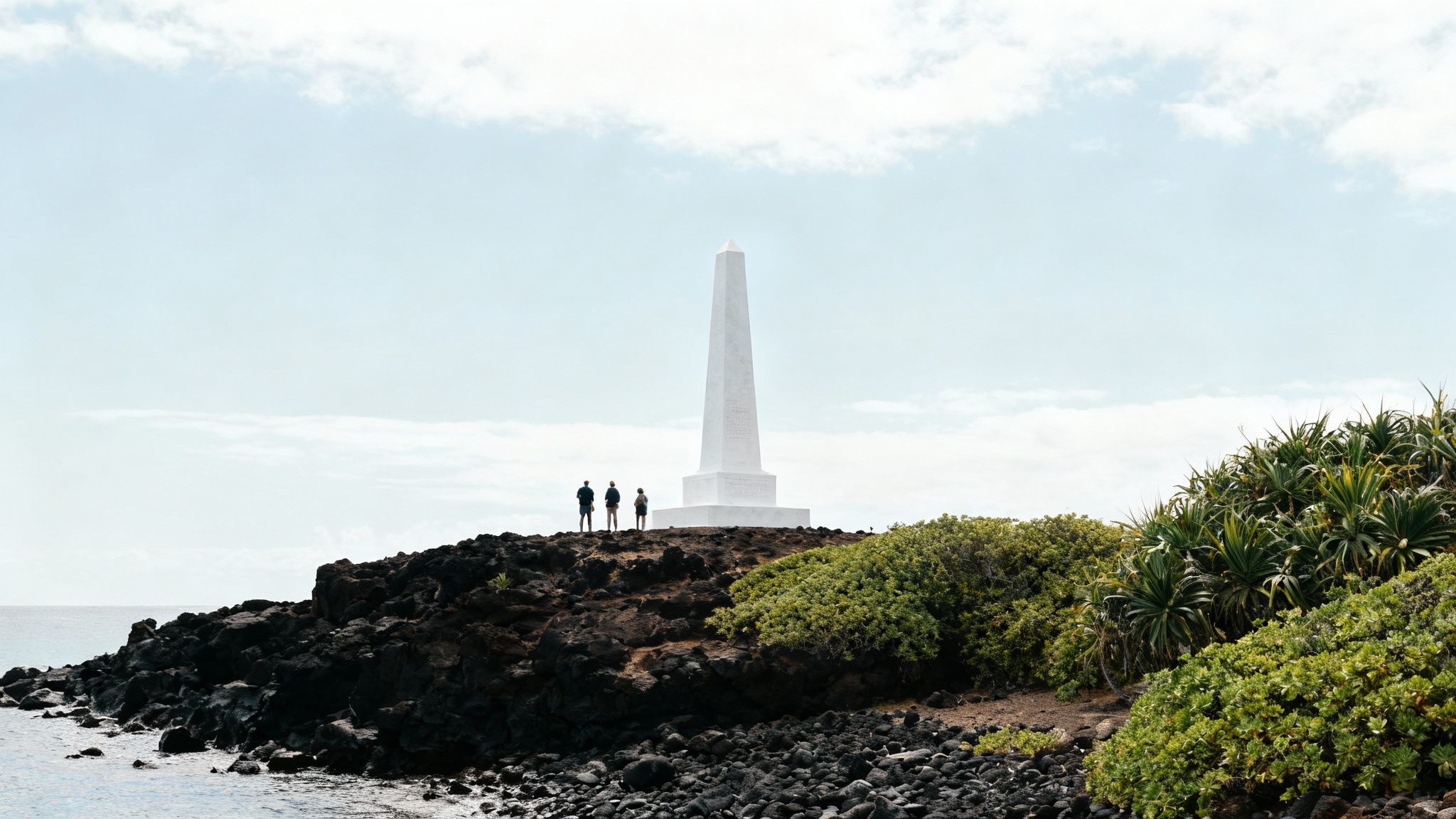 Captain Cook Monument standing on the shore of Kealakekua Bay