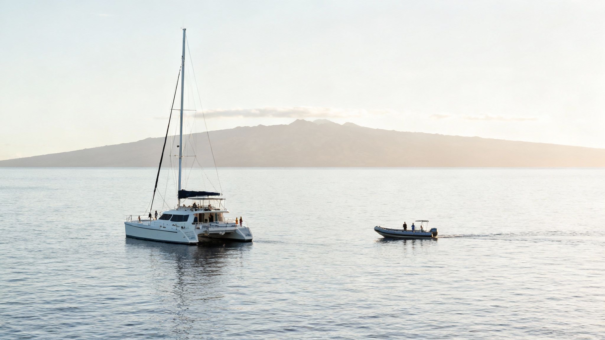 A small tour boat gets an up-close, respectful view of a breaching humpback whale.