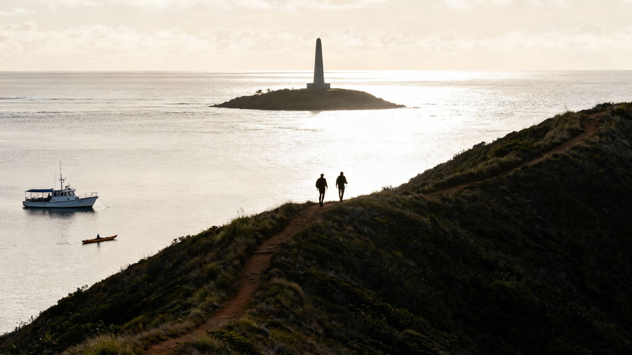 Snorkelers in the clear waters of Kealakekua Bay near the Captain Cook Monument