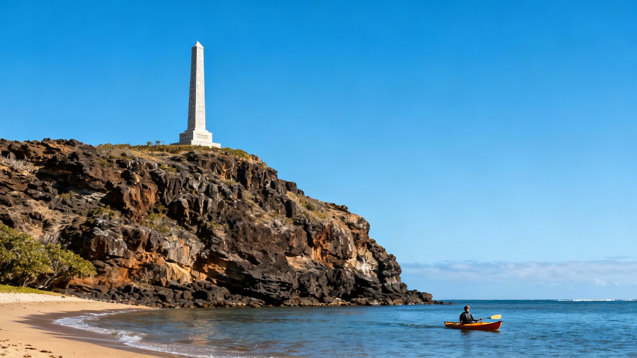 A scenic view of the Captain Cook Monument from the water during a snorkel tour.