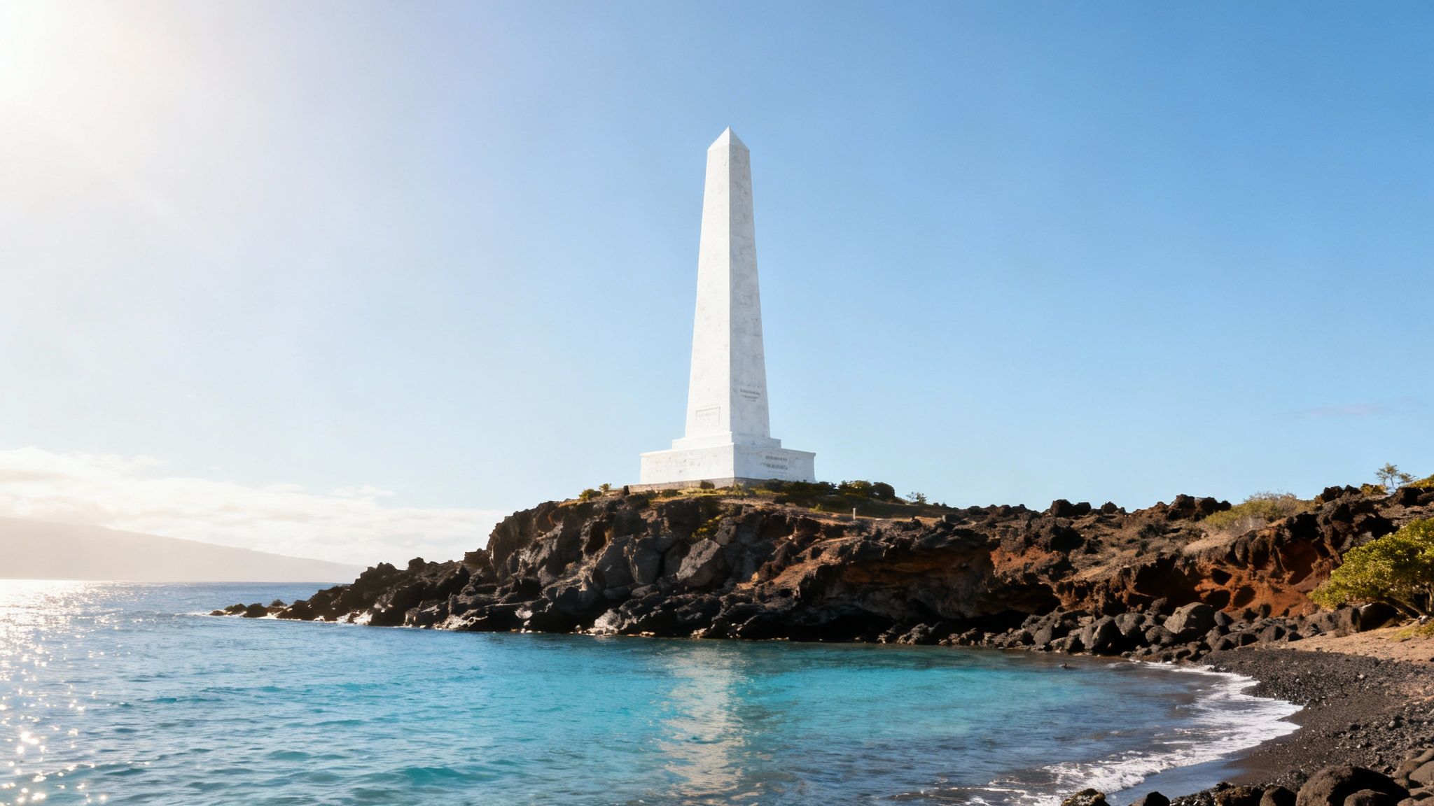 A view of the white Captain Cook Monument on the shores of Kealakekua Bay.
