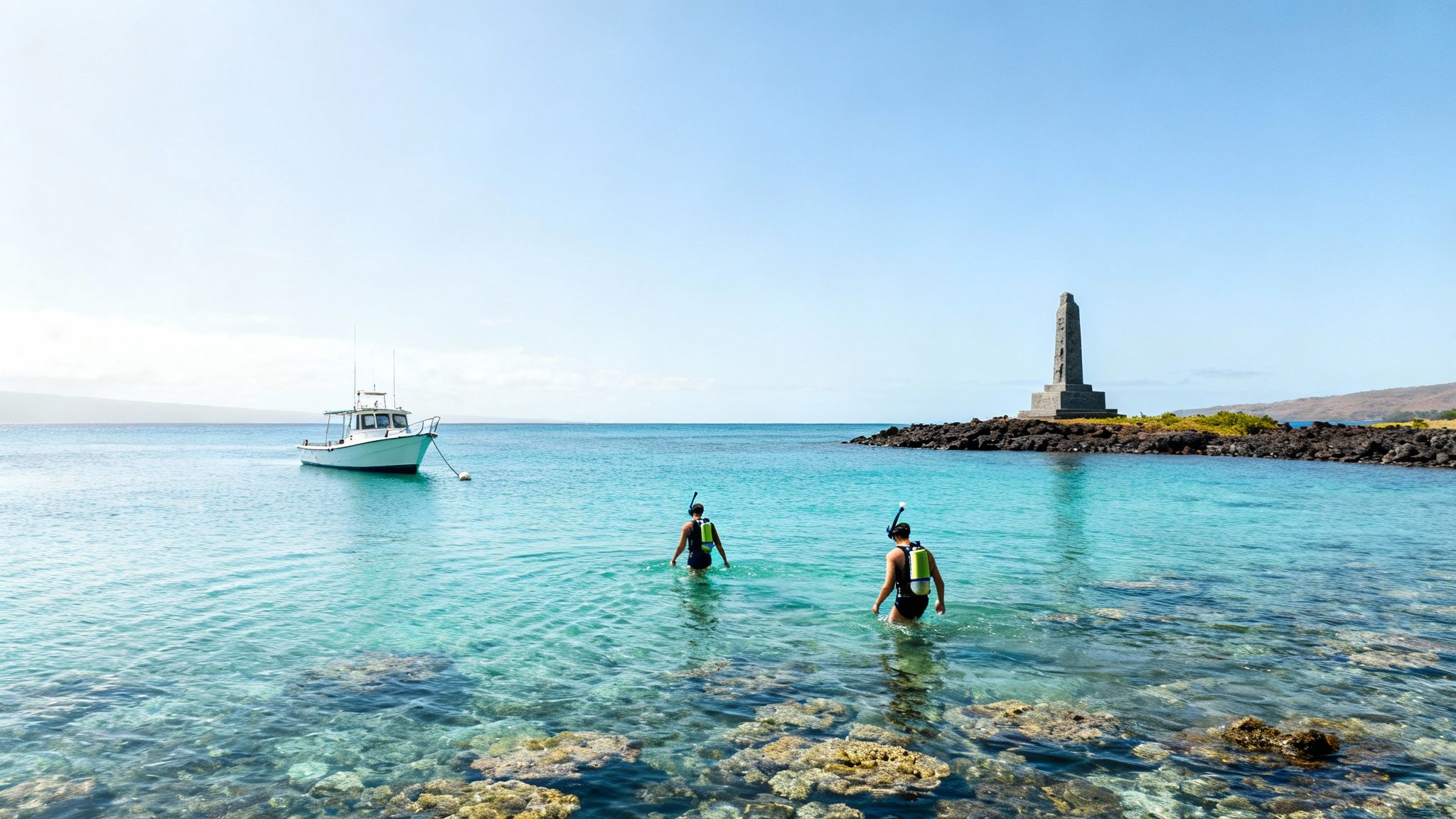 Two people with snorkeling gear wading into clear turquoise water with coral reefs visible.