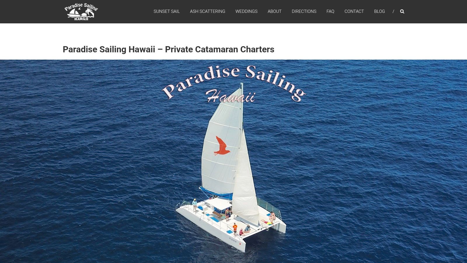 A beautiful sailing catamaran glides on the calm blue waters off the Big Island coast, ready for a private whale watching tour.