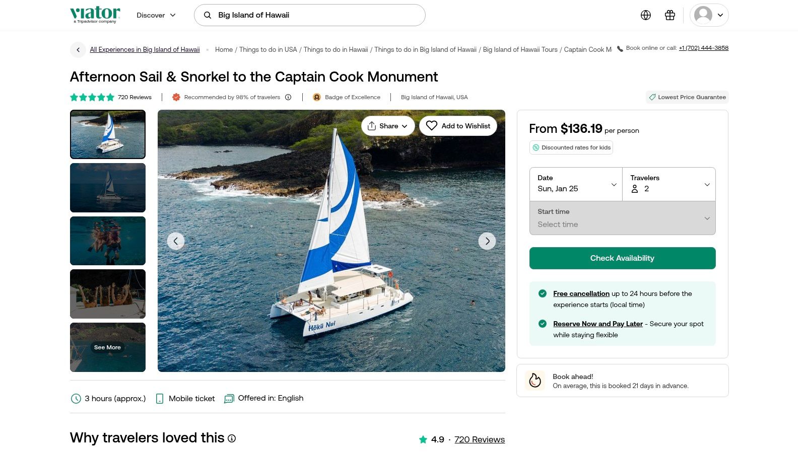 A large catamaran anchored in Kealakekua Bay with snorkelers in the water, a common tour type found on Viator.