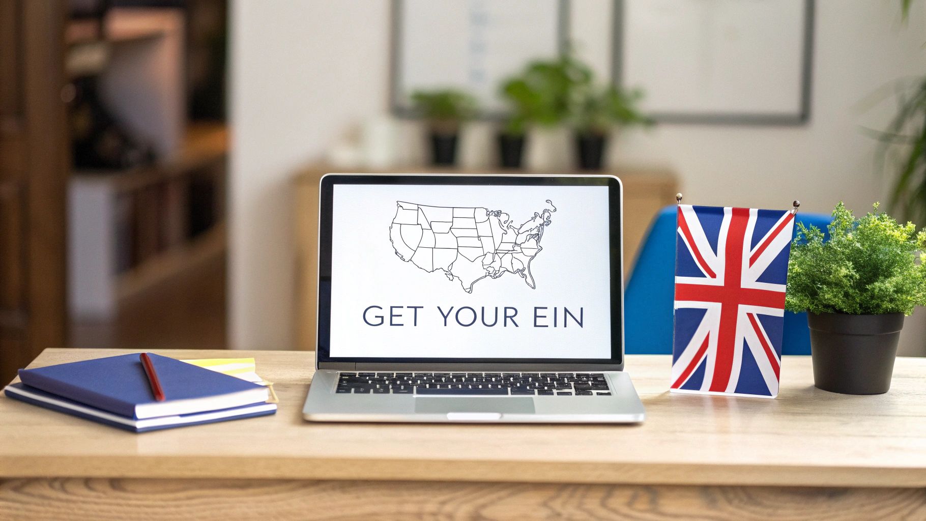 A laptop displaying 'GET YOUR EIN' with a US map, a British flag, and notebooks on a desk.