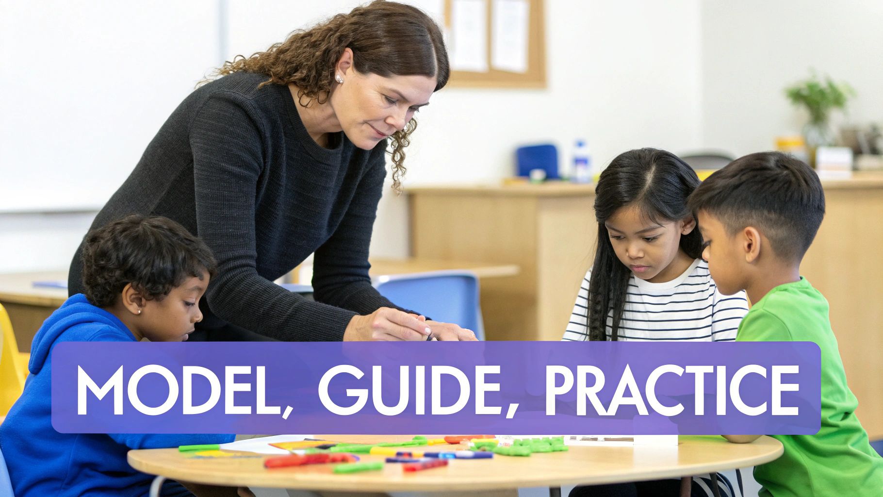 A teacher interacts with three young students at a table during a classroom learning activity.