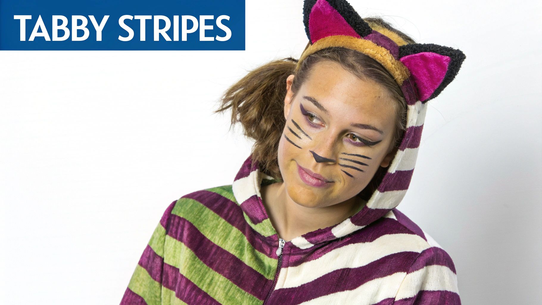 A young woman with cat face paint and a striped cat costume with ears.