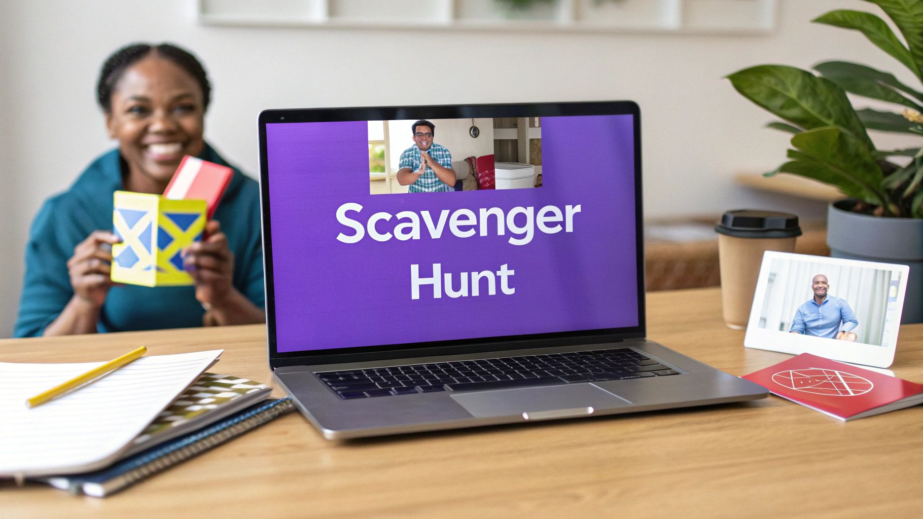 A smiling woman holds colorful cards while a laptop displays 'Scavenger Hunt' for a remote team game.