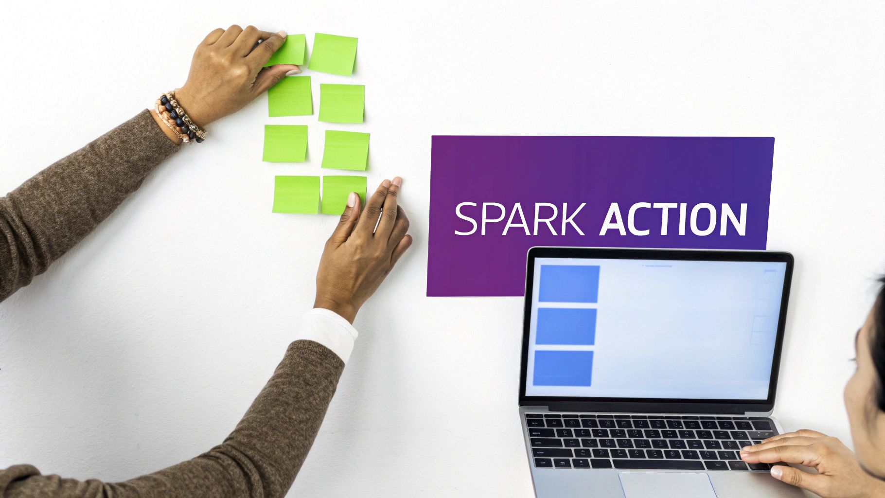 A person using a digital whiteboard with colorful sticky notes, planning workshop activities.
